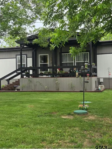 a view of a backyard with a garden and plants