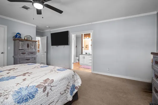 a work room with furniture and a flat screen tv