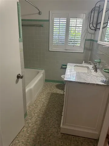 a bathroom with a sink and a bathtub