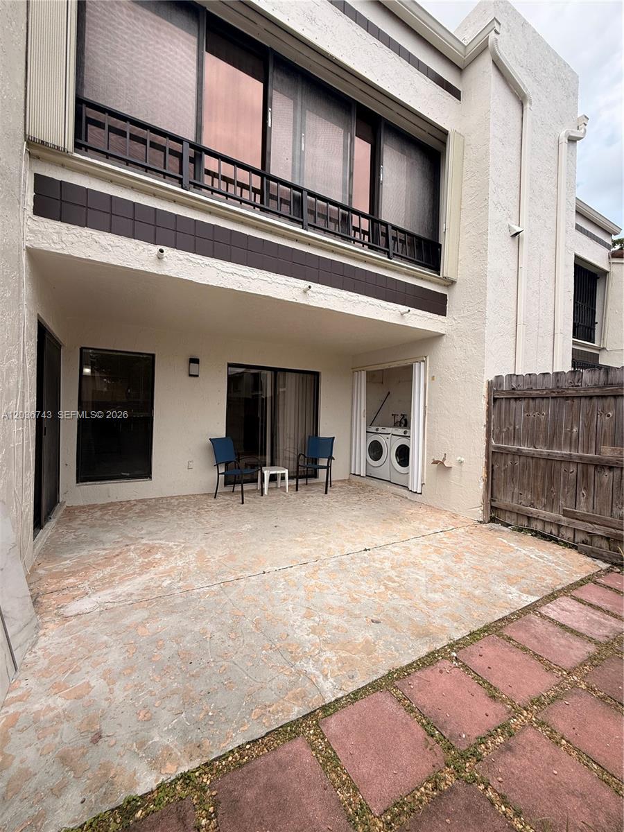 10875 Northwest 7th Street, Unit 1136 Miami, FL 33172 - Photo 23 of 25 a view of a living room and kitchen with furniture