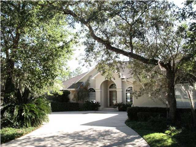 4491 Woodbridge Road Niceville, FL 32578 - Photo 1 of 17 a view of a white house with a yard