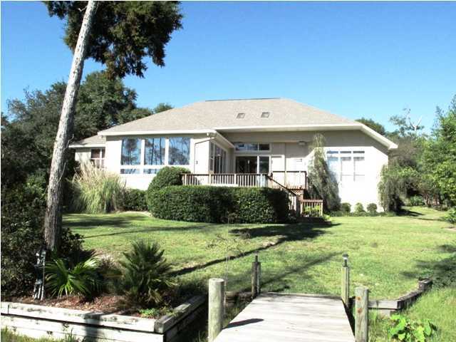 4491 Woodbridge Road Niceville, FL 32578 - Photo 2 of 17 a front view of a house with garden