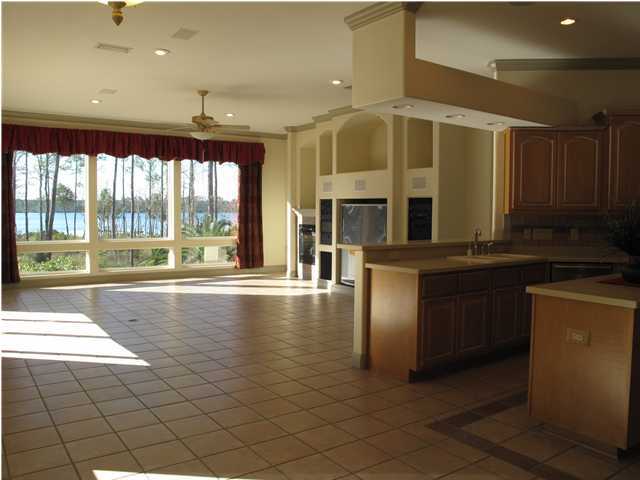 4491 Woodbridge Road Niceville, FL 32578 - Photo 11 of 17 a kitchen with stainless steel appliances granite countertop a refrigerator and a stove
