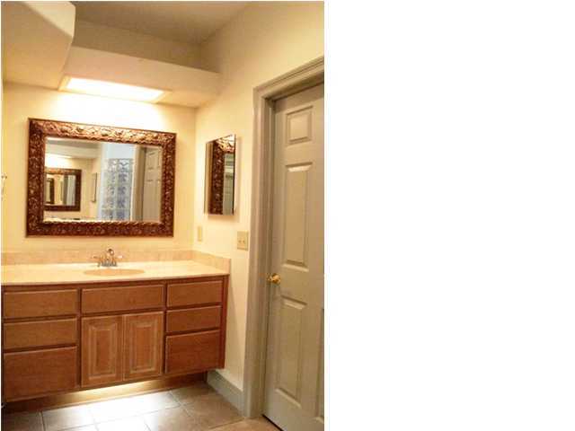 4491 Woodbridge Road Niceville, FL 32578 - Photo 13 of 17 a bathroom with a sink and a mirror