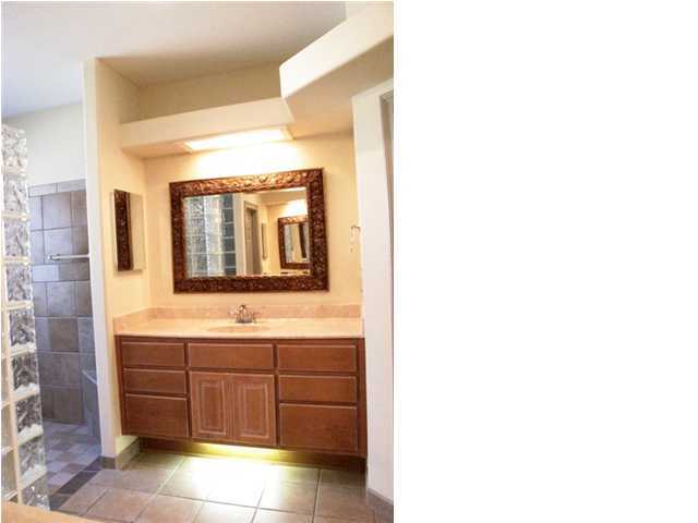 4491 Woodbridge Road Niceville, FL 32578 - Photo 14 of 17 a bathroom with a sink and a mirror