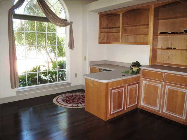 4491 Woodbridge Road Niceville, FL 32578 - Photo 17 of 17 a kitchen with stainless steel appliances granite countertop a stove a sink and a large window