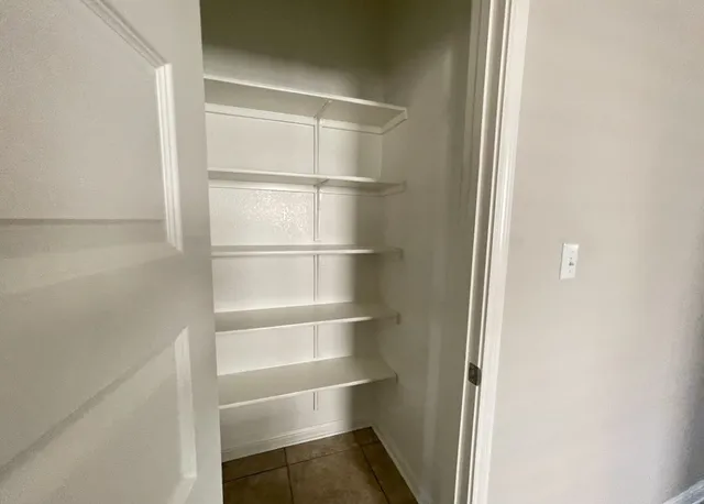 a kitchen with stainless steel appliances a stove a microwave and a refrigerator