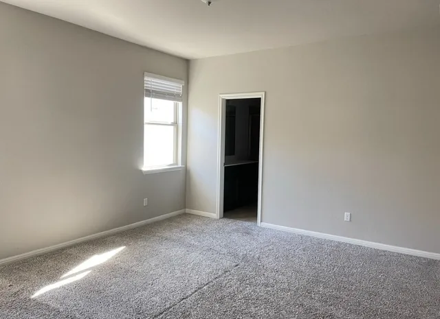 a view of empty room with windows