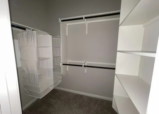 a bathroom with a double vanity sink mirror and shower