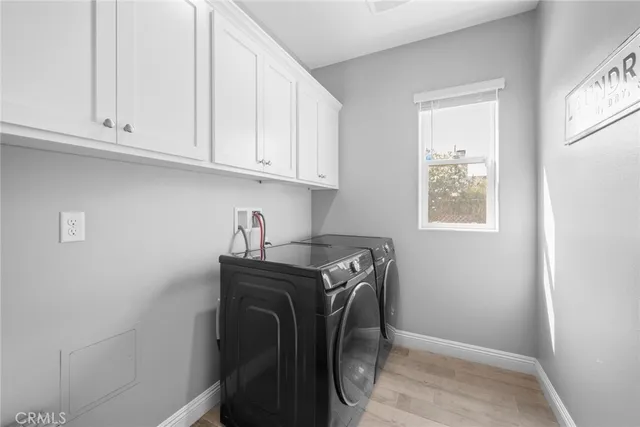 a storage room with washer and dryer