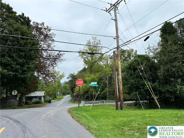 a view of a chair and table in the garden