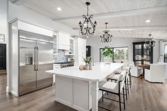 a view of a dining room with furniture wooden floor and chandelier