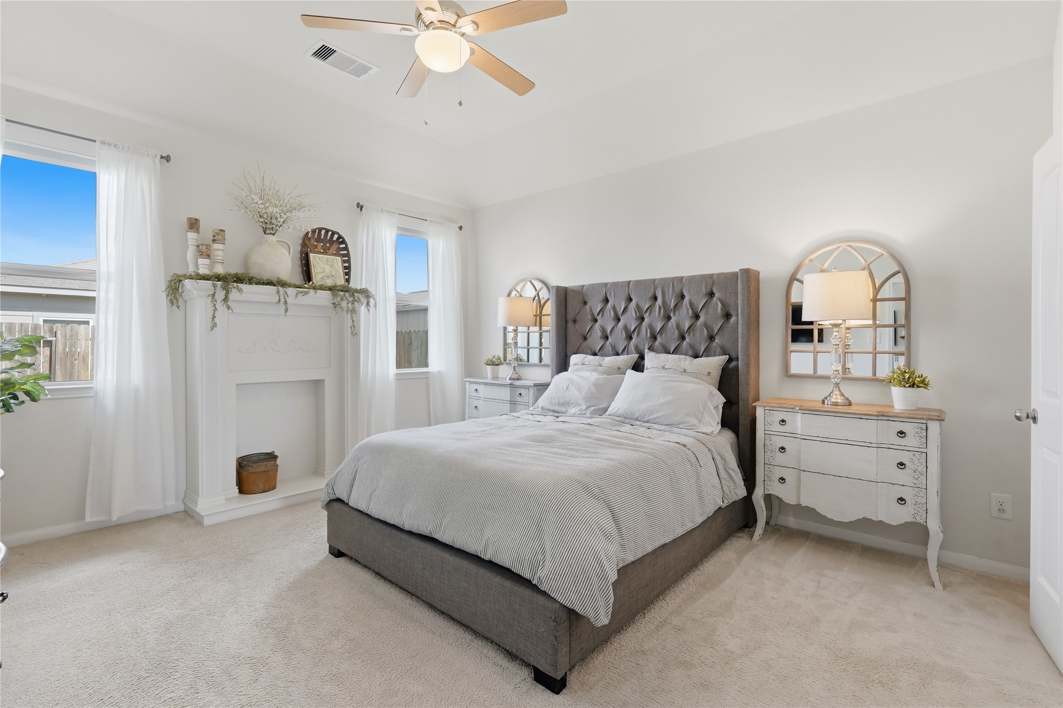 3579 Korina Way Conroe, TX 77306 - Photo 12 of 20 a bedroom with a bed and a chandelier