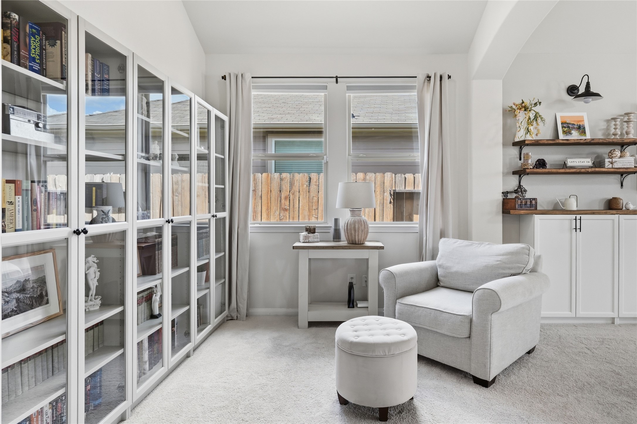 3579 Korina Way Conroe, TX 77306 - Photo 4 of 20 a living room with furniture and a book shelf