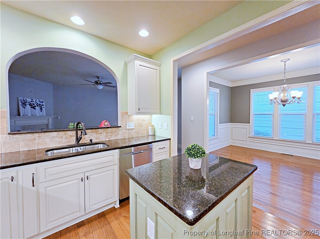 175 Pine Hawk Drive Spring Lake, NC 28390 - Photo 11 of 41 a bathroom with a granite countertop sink a mirror and a sink