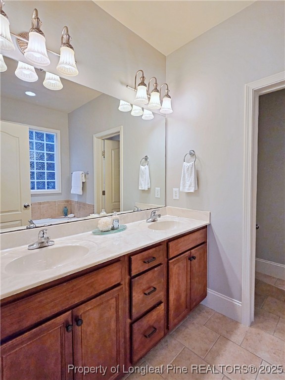 175 Pine Hawk Drive Spring Lake, NC 28390 - Photo 19 of 41 a bathroom with a sink vanity and a mirror
