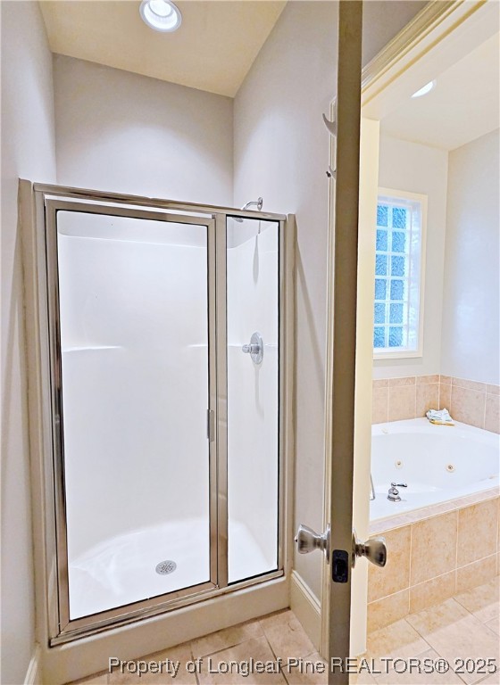 175 Pine Hawk Drive Spring Lake, NC 28390 - Photo 22 of 41 a bathroom with a bathtub and a shower