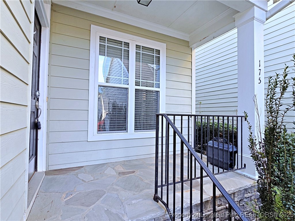 175 Pine Hawk Drive Spring Lake, NC 28390 - Photo 3 of 41 a view of a balcony with a couple of flower plants