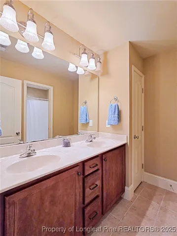 a bathroom with a sink double vanity and a mirror