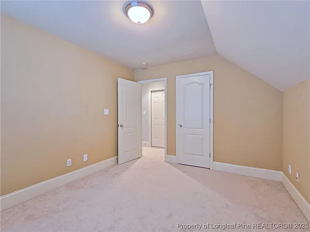 an empty room with closet area