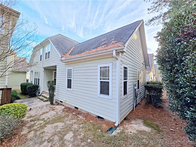 a front view of a house with a garage