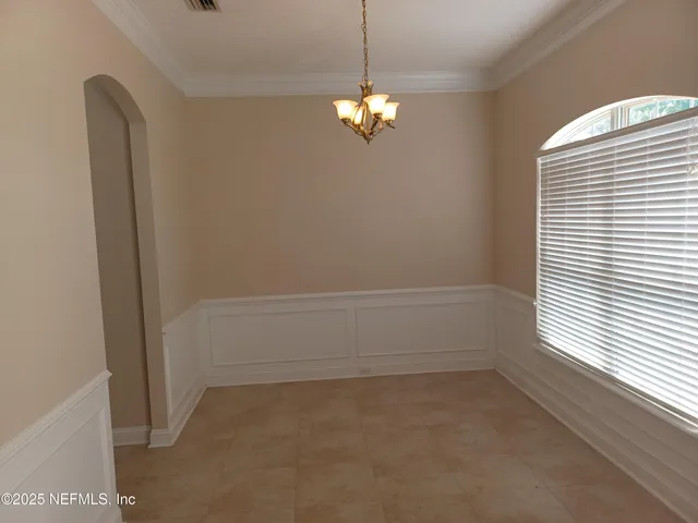 a view of room with window and ceiling fan