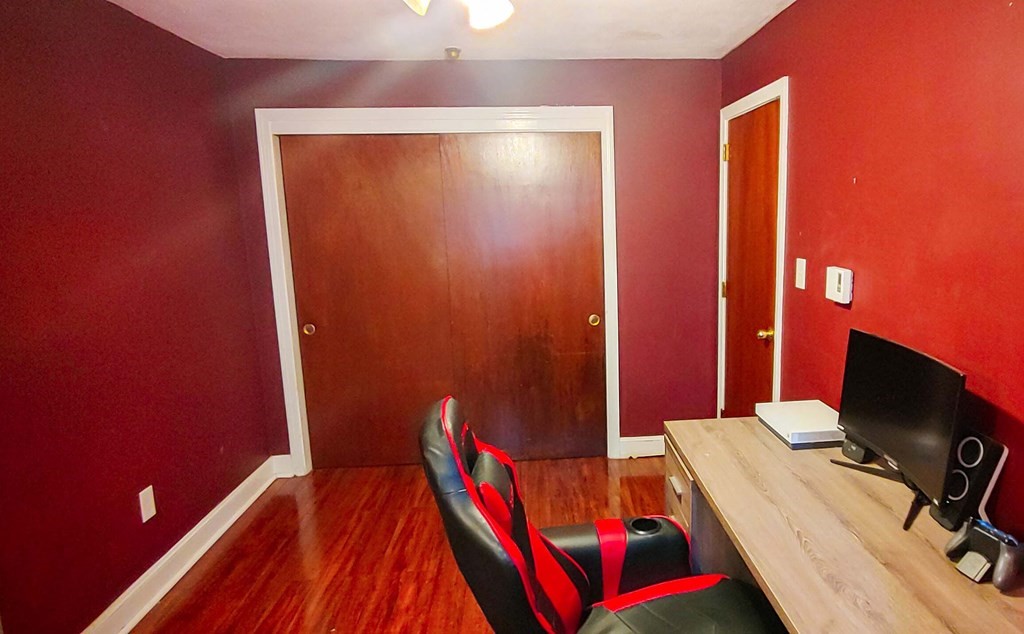 1 Walker Road, Unit 1 North Andover, MA 01845 - Photo 14 of 17 a bedroom with a bed and a flat screen tv