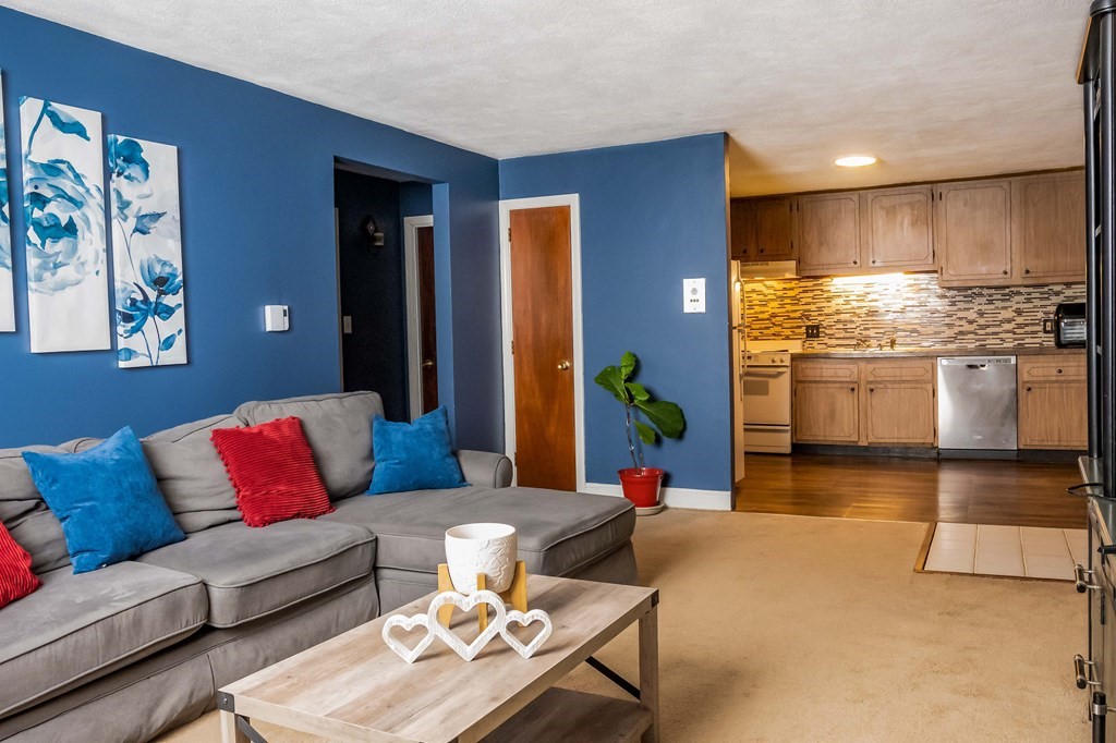 1 Walker Road, Unit 1 North Andover, MA 01845 - Photo 2 of 17 a living room with granite countertop kitchen island furniture and kitchen view