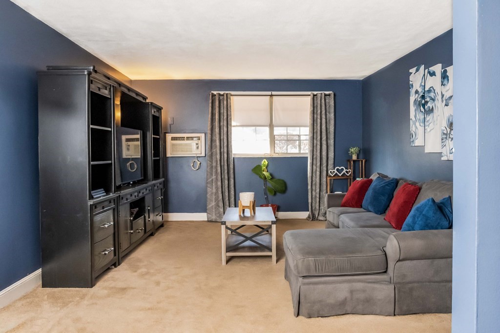 1 Walker Road, Unit 1 North Andover, MA 01845 - Photo 5 of 17 a living room with furniture and a flat screen tv