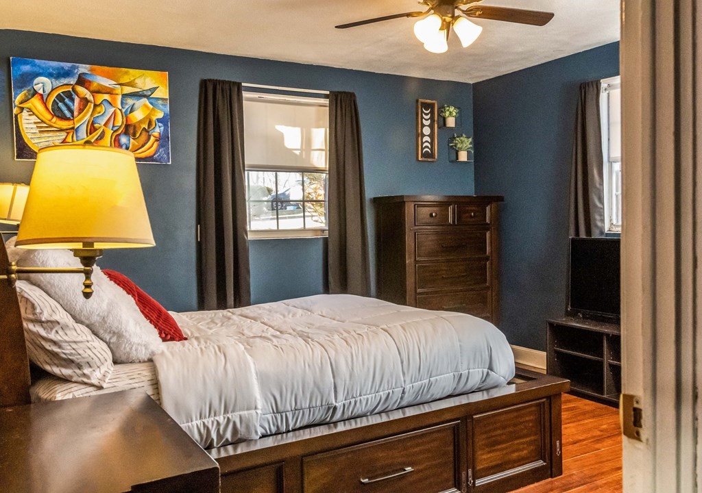 1 Walker Road, Unit 1 North Andover, MA 01845 - Photo 9 of 17 a bedroom with a bed and a chandelier