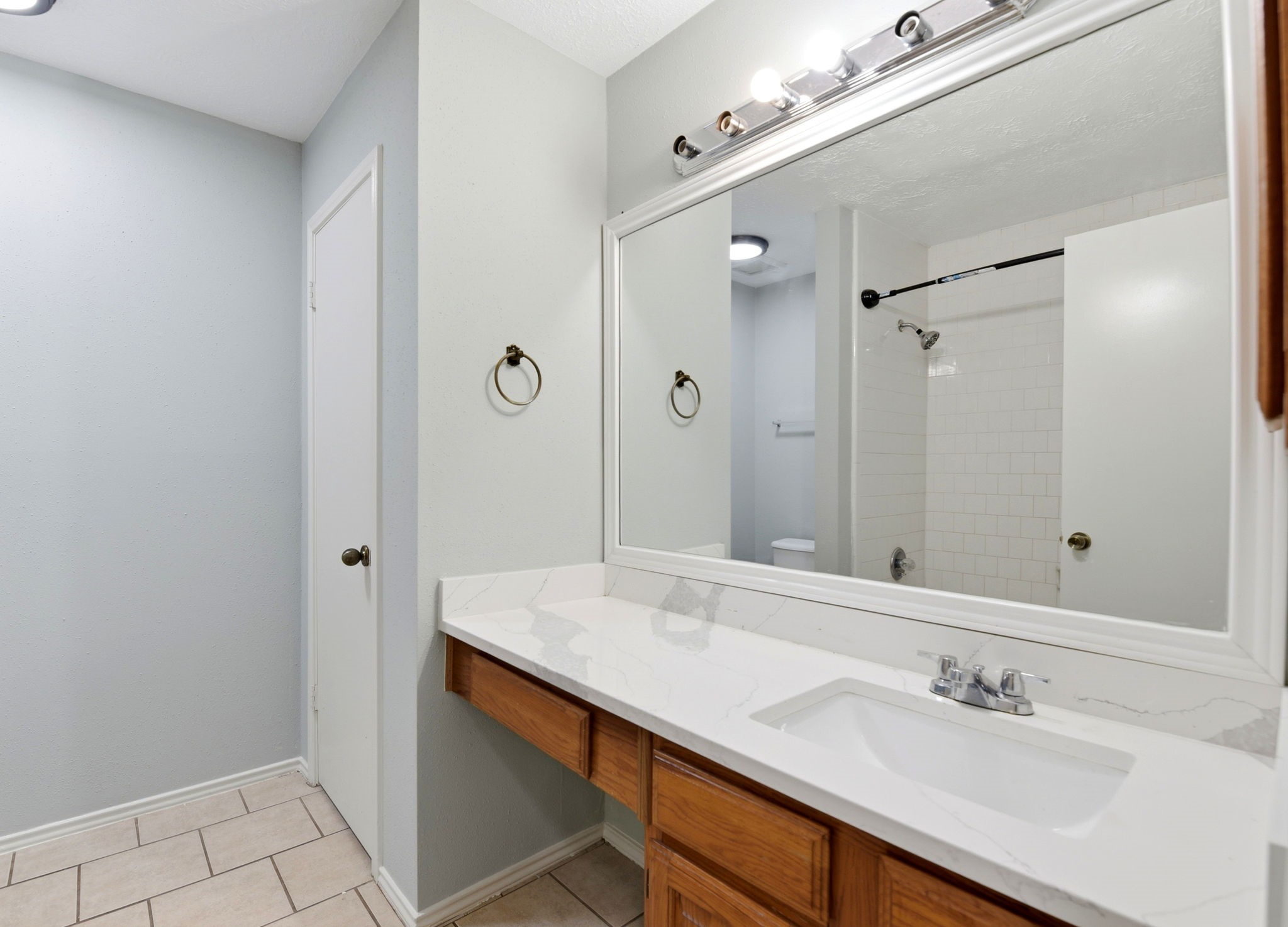 21330 Golden Dove Drive Spring, TX 77388 - Photo 22 of 29 Perfectly placed for guests and family, the secondary full bathroom features a large, well-lit vanity.