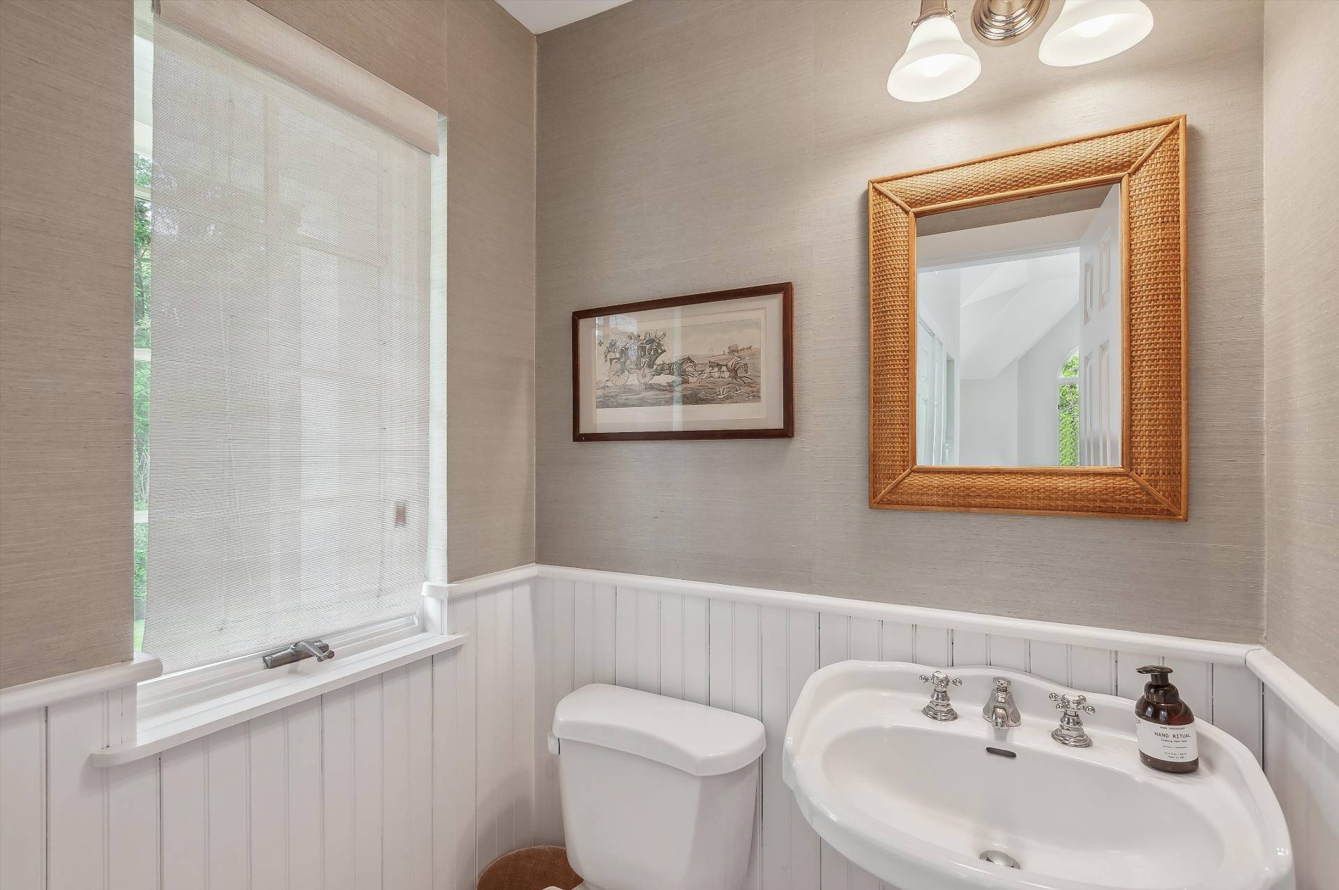 127 Narrow Lane South Water Mill, NY 11976 - Photo 13 of 37 a bathroom with a toilet a sink and mirror