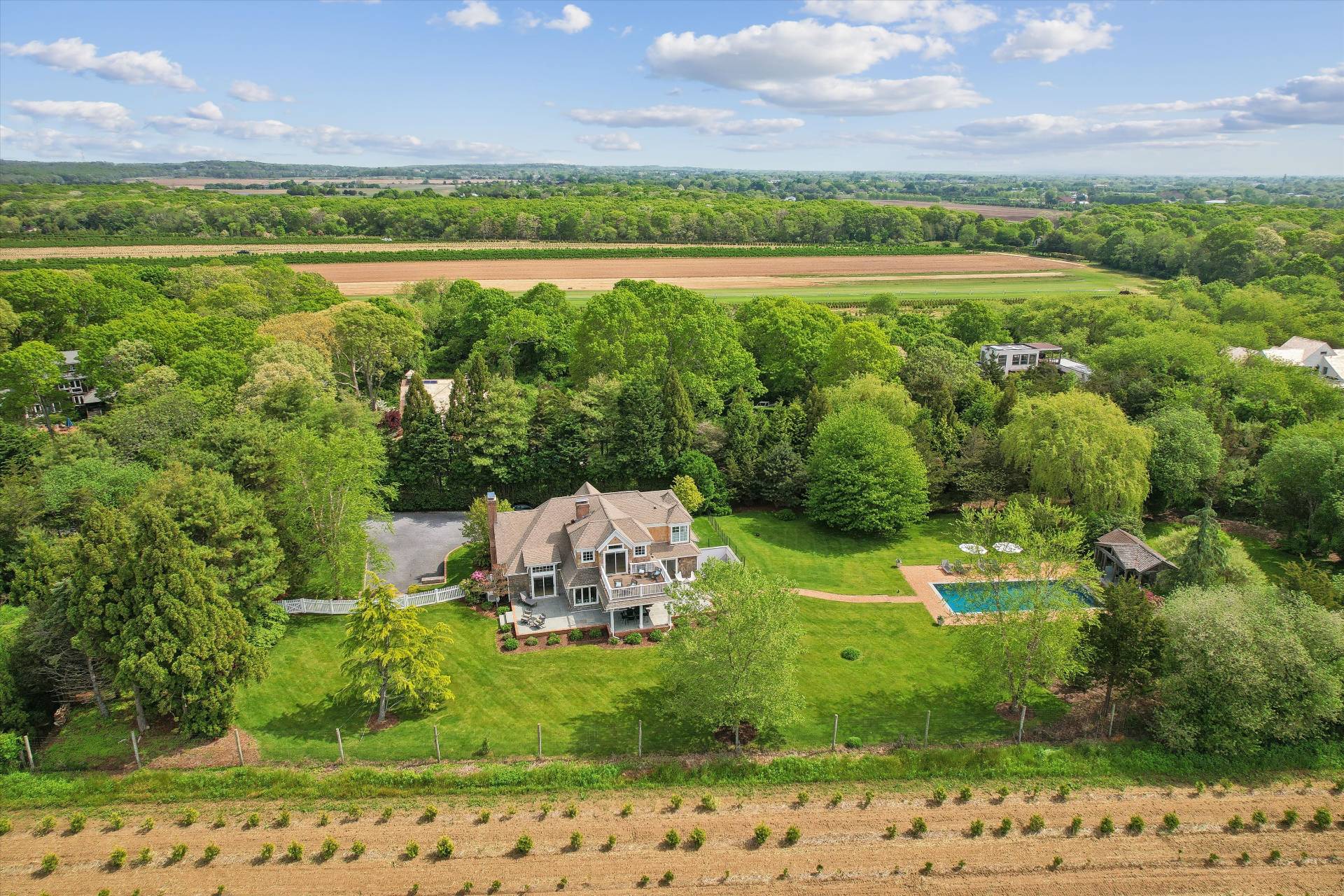 127 Narrow Lane South Water Mill, NY 11976 - Photo 3 of 37 a view of a lake with a house in the background