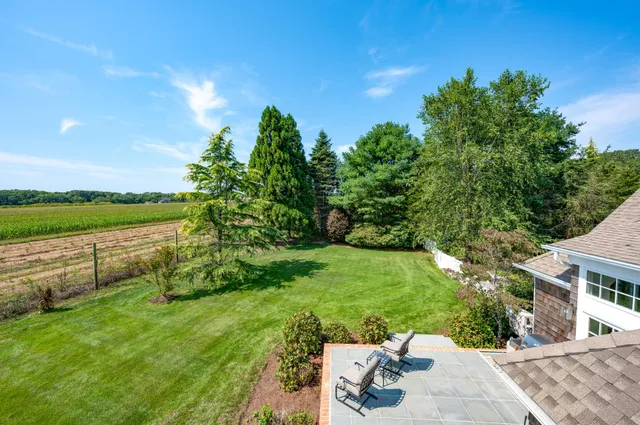 a view of a garden with a building in the background
