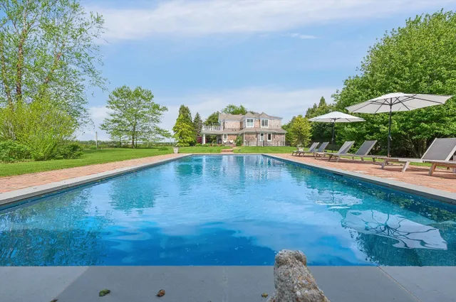 a view of a swimming pool and an outdoor space