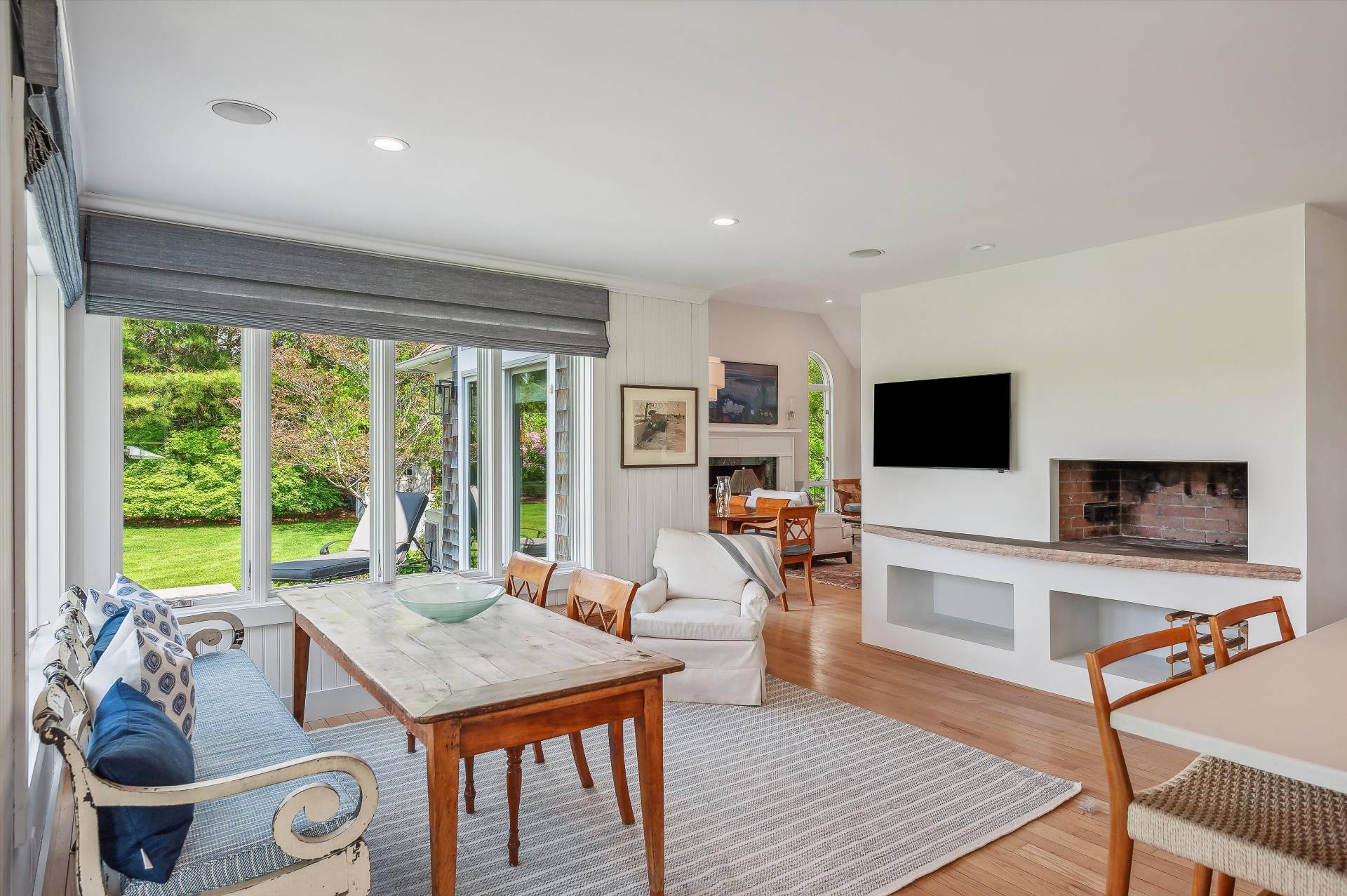 127 Narrow Lane South Water Mill, NY 11976 - Photo 9 of 37 a living room with furniture a flat screen tv and a large window