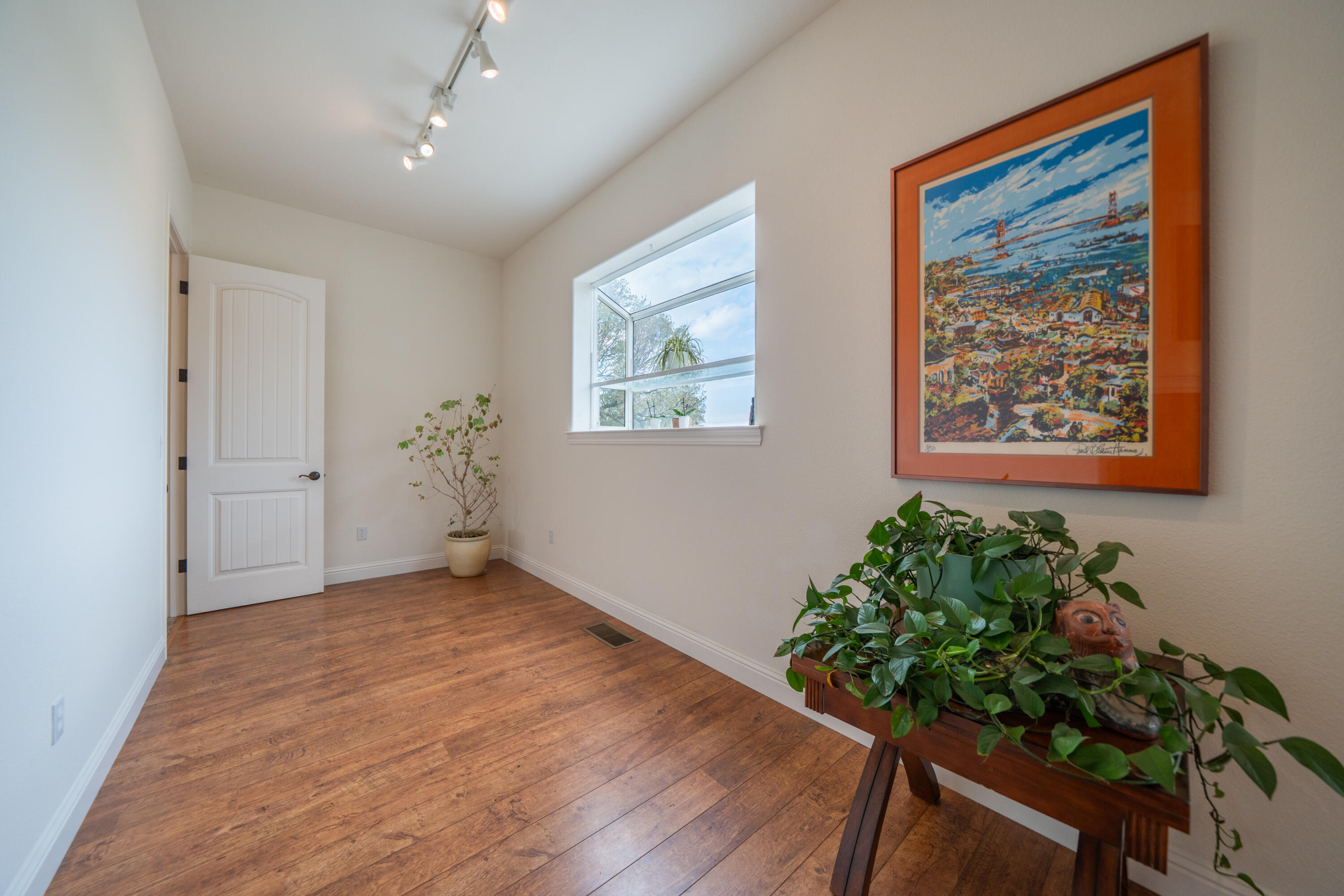8180 Whispering Oaks Road Redding, CA 96002 - Photo 24 of 100 a view of an entryway with wooden floor