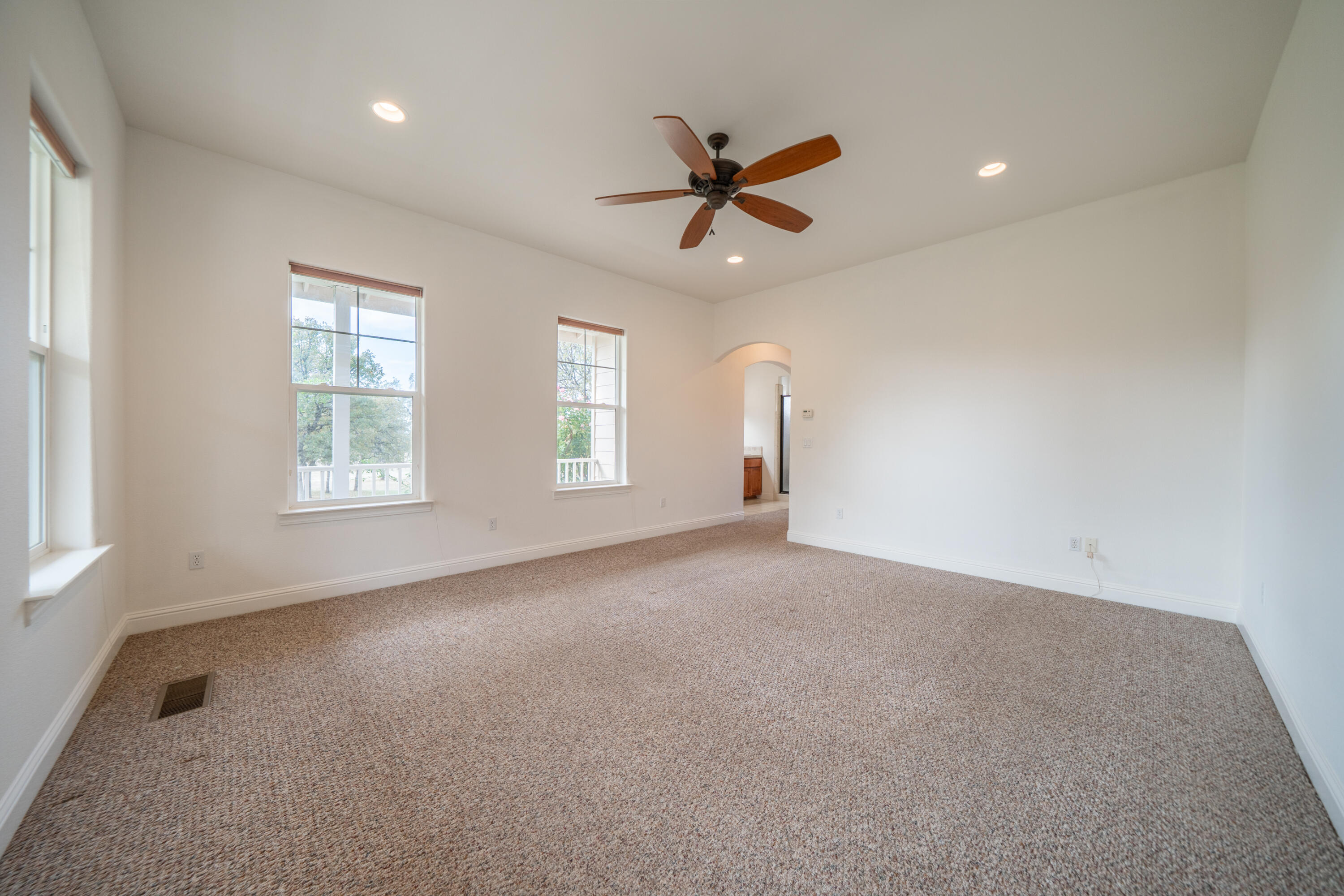 8180 Whispering Oaks Road Redding, CA 96002 - Photo 27 of 100 a view of a livingroom with a ceiling fan and window