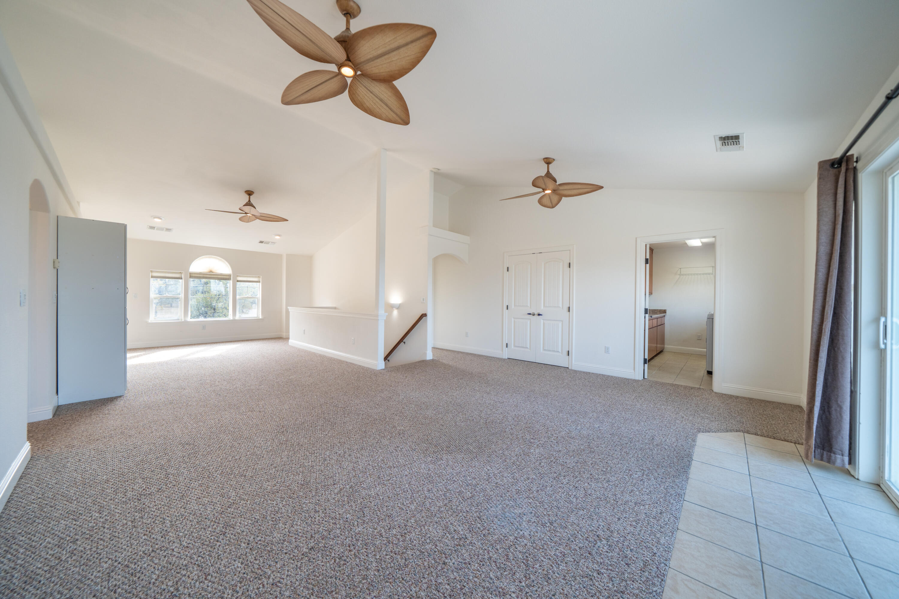 8180 Whispering Oaks Road Redding, CA 96002 - Photo 33 of 100 a view of a livingroom with a ceiling fan and window