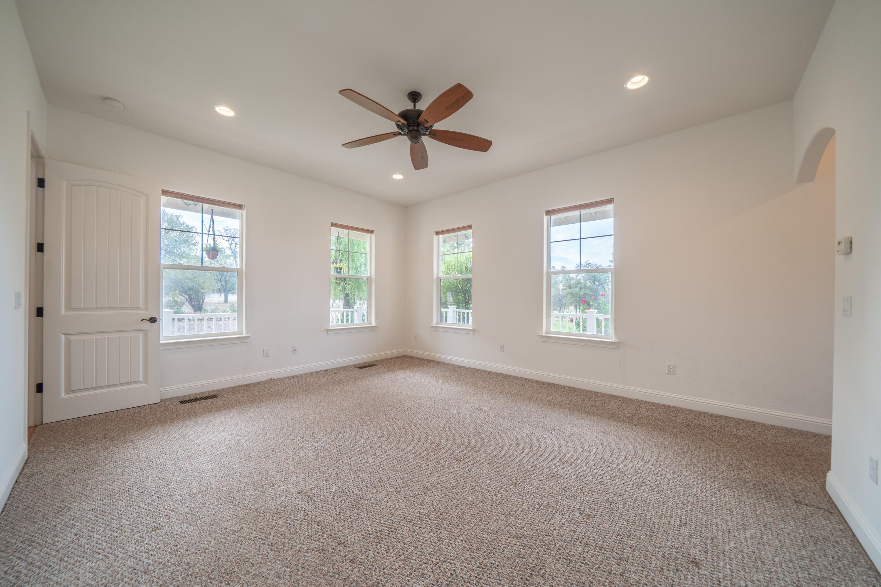 8180 Whispering Oaks Road Redding, CA 96002 - Photo 34 of 100 a view of a livingroom with a ceiling fan and window