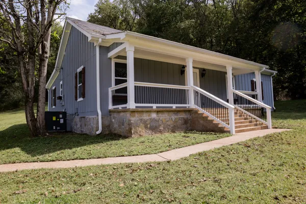a backyard of a house with lots of green space