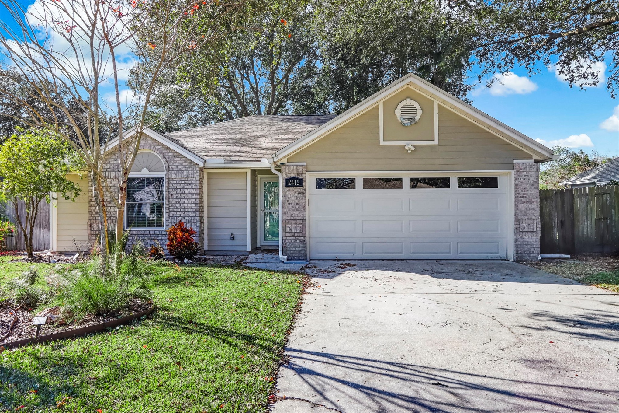 2415 Will Hardee Road Fernandina Beach, FL 32034 - Photo 4 of 59 a front view of a house with a yard and garage
