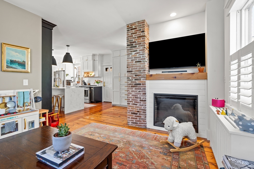1 Gregory Street Marblehead, MA 01945 - Photo 11 of 42 a living room with furniture fireplace and flat screen tv