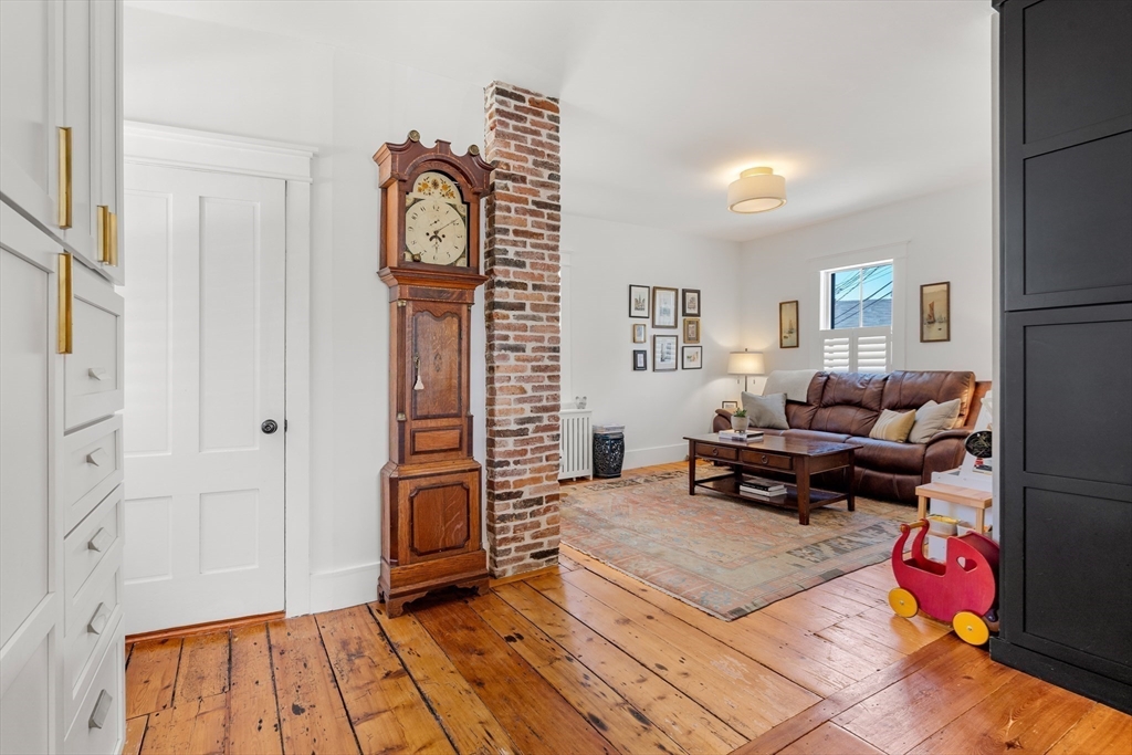 1 Gregory Street Marblehead, MA 01945 - Photo 12 of 42 a living room with furniture a wooden floor and a clock