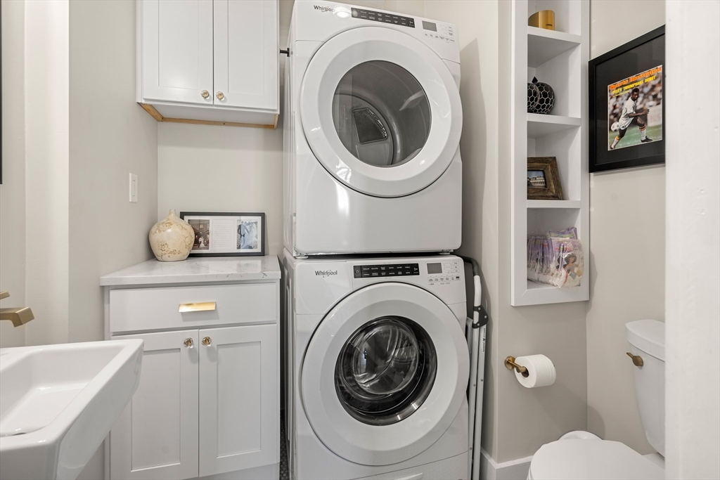 1 Gregory Street Marblehead, MA 01945 - Photo 20 of 42 a bathroom with a toilet a sink and bathtub