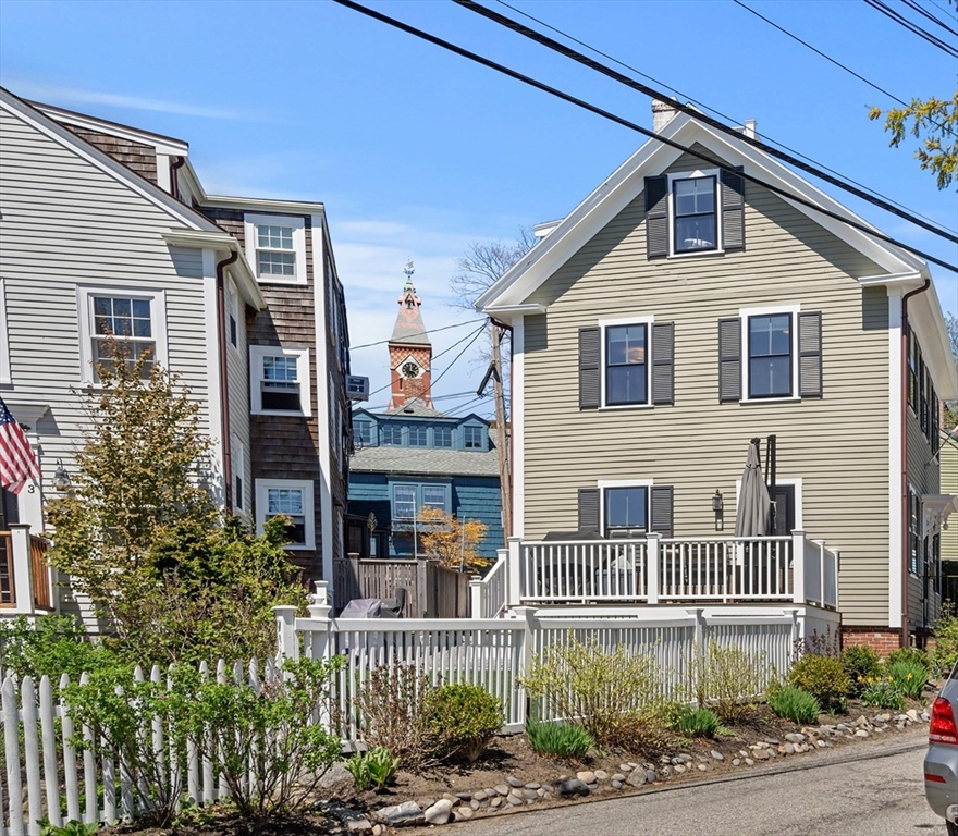 1 Gregory Street Marblehead, MA 01945 - Photo 3 of 42 a front view of a house with a yard