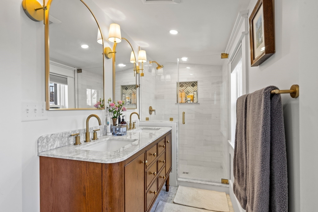 1 Gregory Street Marblehead, MA 01945 - Photo 33 of 42 a bathroom with a sink a double vanity and a mirror