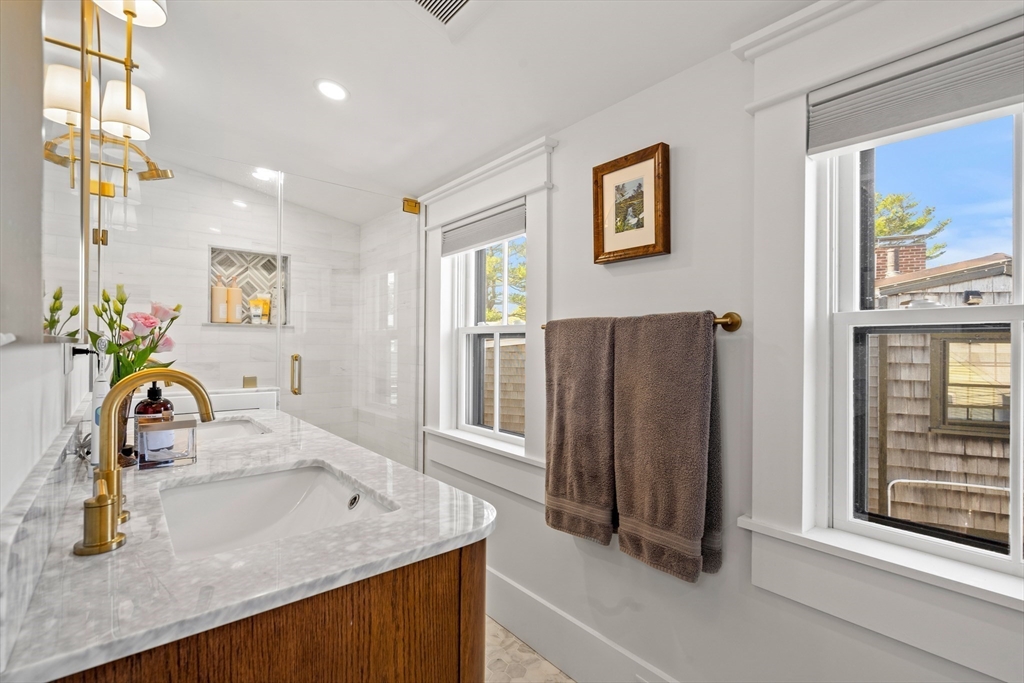 1 Gregory Street Marblehead, MA 01945 - Photo 34 of 42 a kitchen with stainless steel appliances granite countertop a sink and a refrigerator