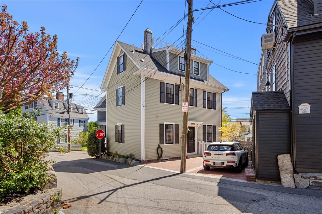 1 Gregory Street Marblehead, MA 01945 - Photo 8 of 42 a car parked in front of a building