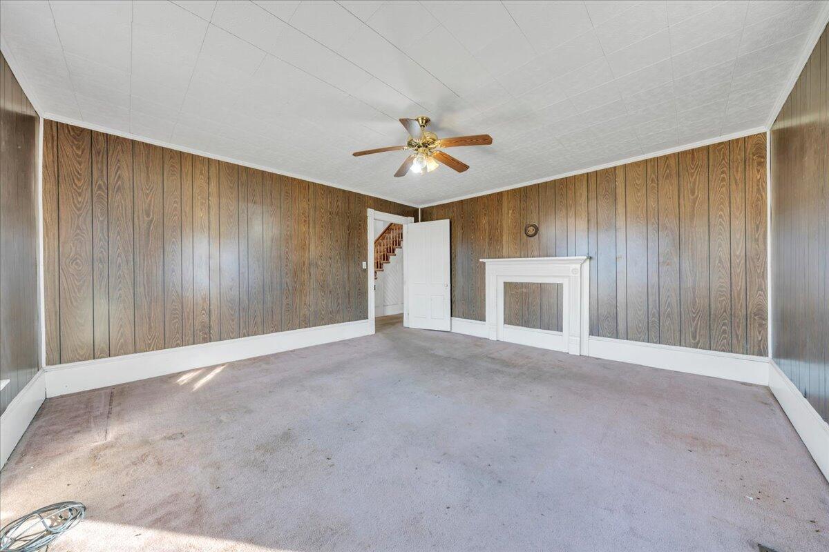 5402 Roanoke Road Troutville, VA 24175 - Photo 11 of 54 an empty room with a ceiling fan and a window